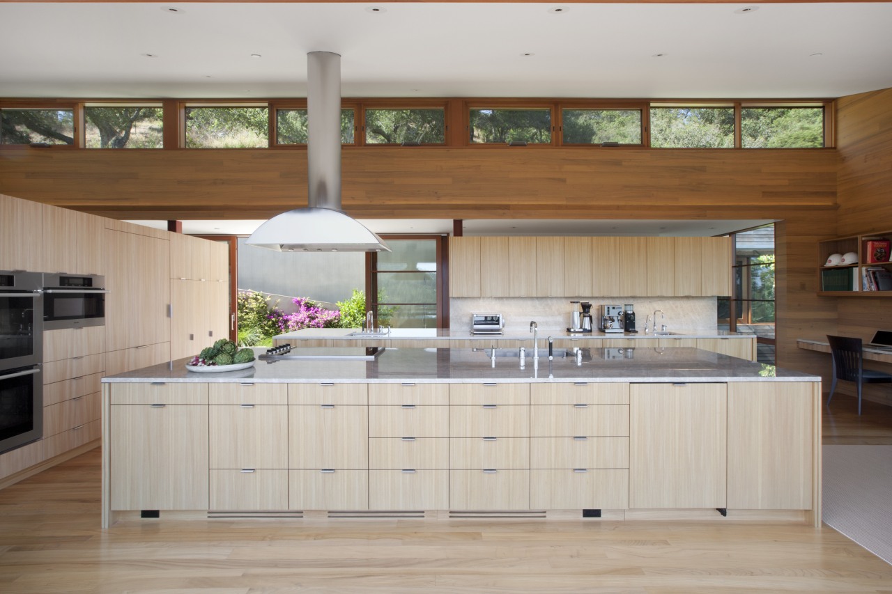 Clerestory windows provide views of the hillside behind cabinetry, countertop, cuisine classique, hardwood, interior design, kitchen, room, gray