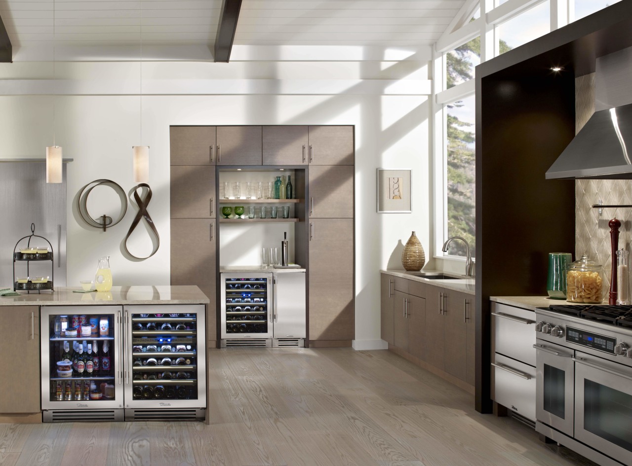 this kitchen is organised into a number of countertop, home appliance, interior design, kitchen, kitchen appliance, major appliance, refrigerator, gray