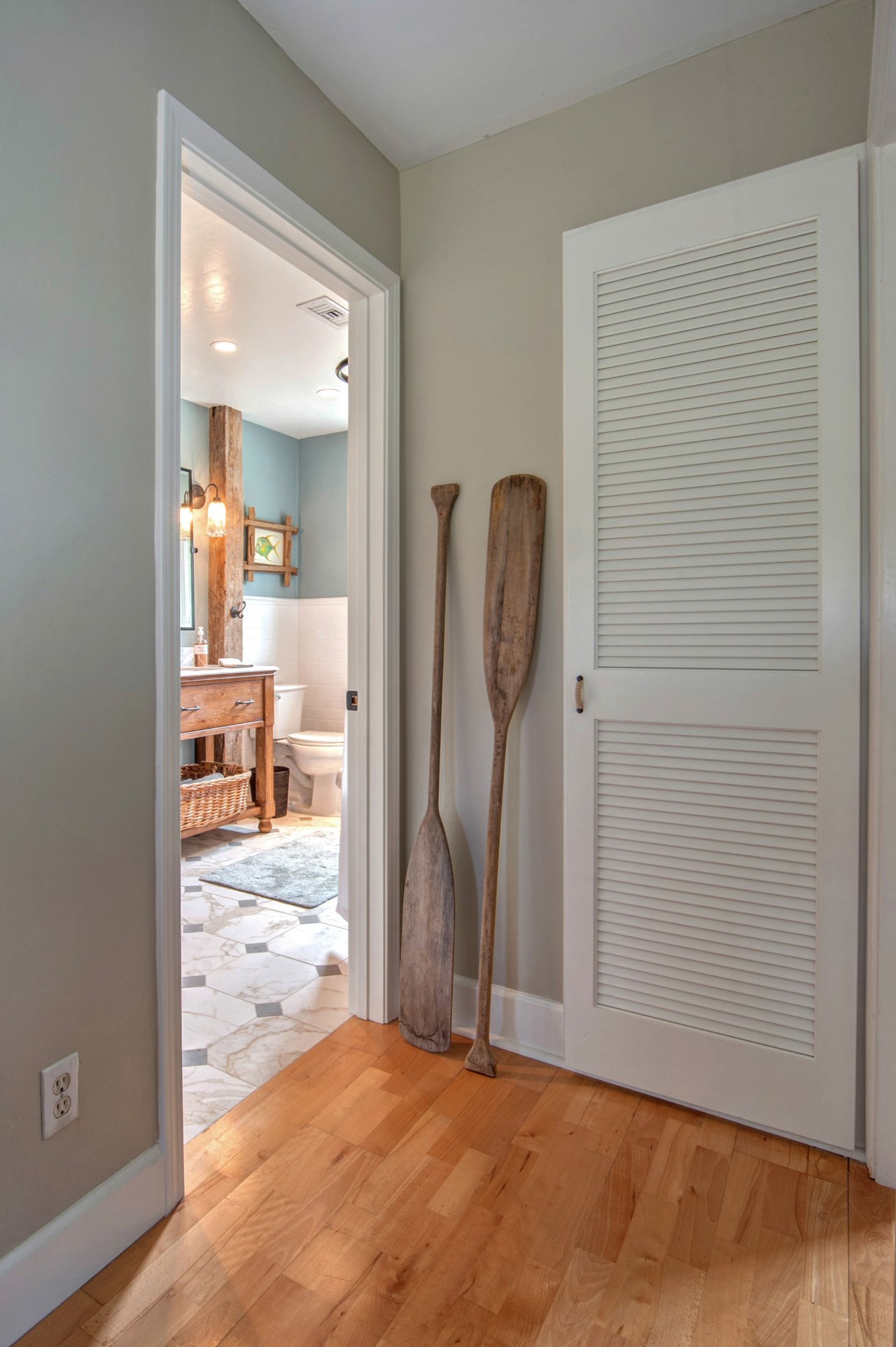 This modest guest bathroom celebrates a relaxed seaside ceiling, door, floor, flooring, hardwood, home, interior design, laminate flooring, molding, real estate, room, wall, window, window covering, wood, wood flooring, gray