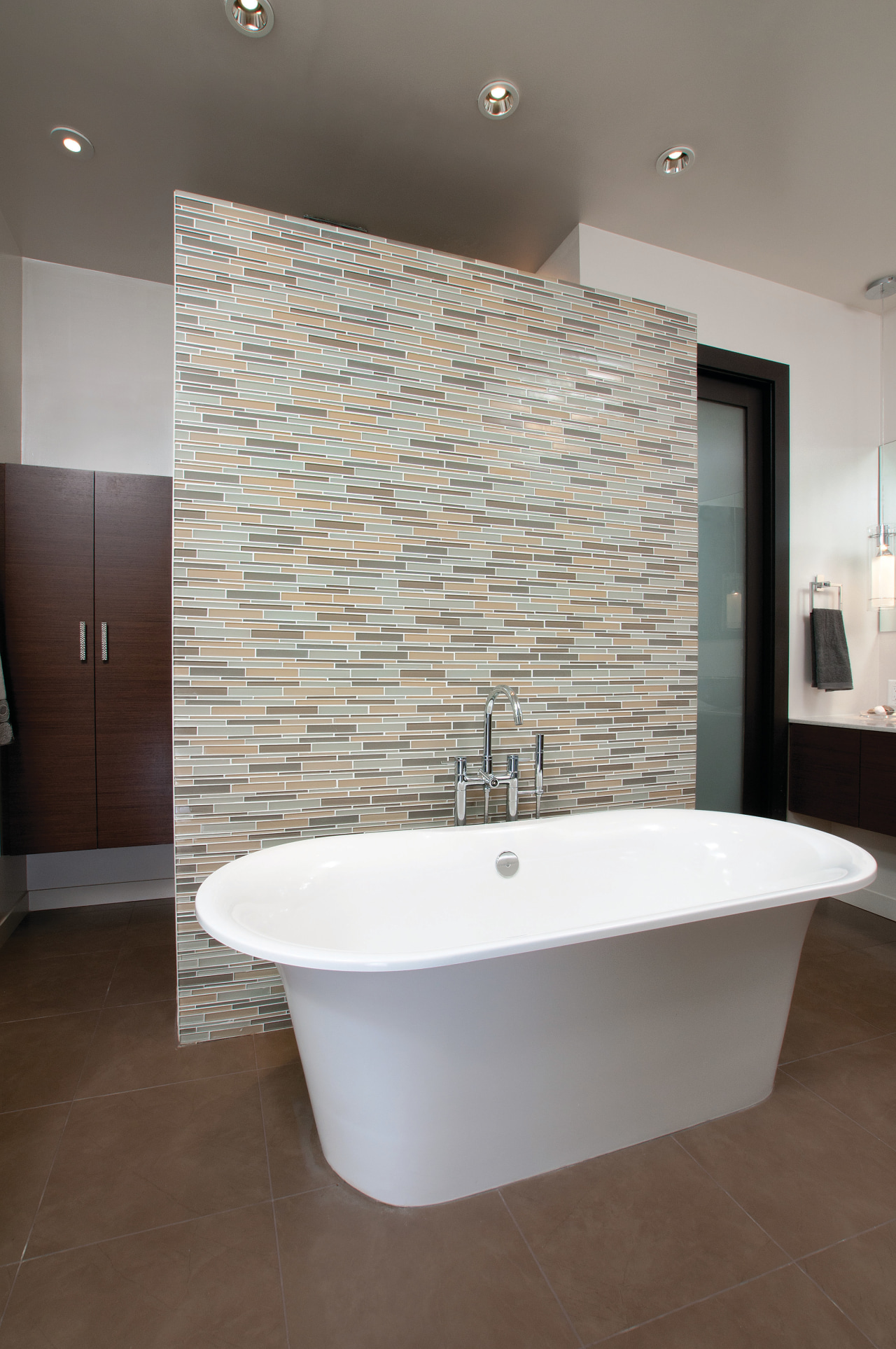 A Victoria & Albert bathtub is the centerpiece architecture, bathroom, floor, flooring, home, interior design, plumbing fixture, room, sink, tap, tile, wall, gray
