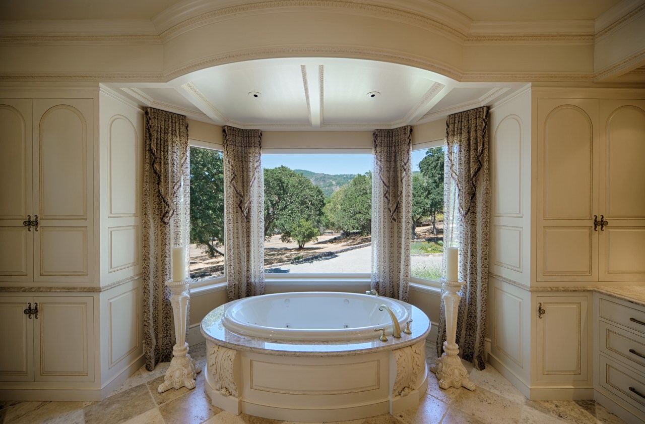 An MTI Whirlpools tub sits in front of bathroom, bathtub, estate, home, interior design, real estate, room, window, brown, gray