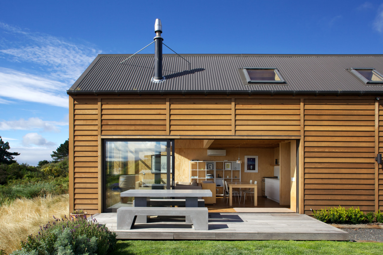 The living area of this simple beach house cottage, elevation, facade, home, house, real estate, roof, siding