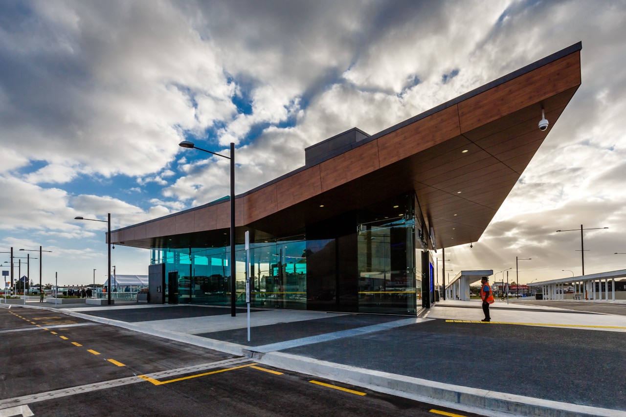 A substantial, timber-clad gullwing roof appears to float architecture, building, cloud, corporate headquarters, facade, infrastructure, sky, gray, black