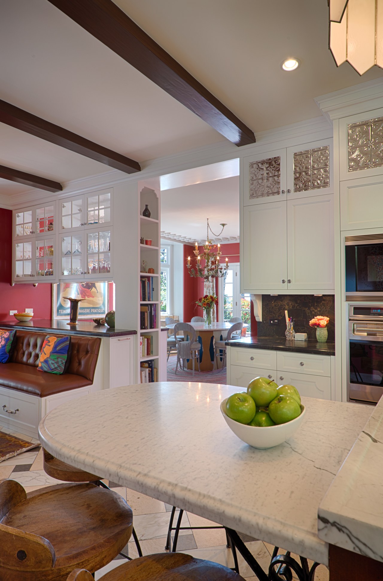 A double-sided glazed overhead cabinet forms a transparent ceiling, countertop, home, house, interior design, kitchen, living room, real estate, room, table, gray