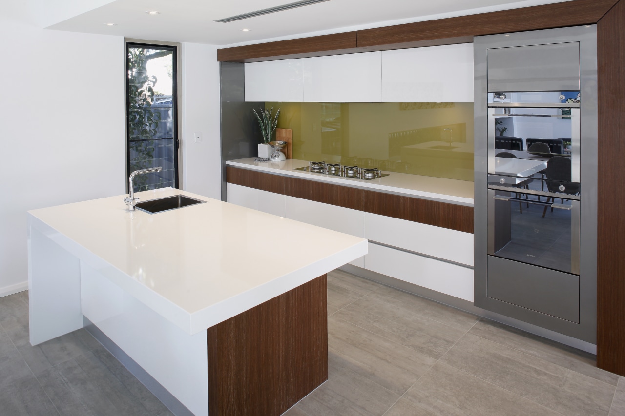 This award-winning kitchen features timber veneer framing around cabinetry, countertop, cuisine classique, floor, interior design, kitchen, real estate, white, gray