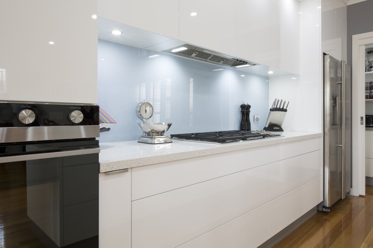 Clean-lined white kitchen by Kitchen &amp; Home with cabinetry, countertop, cuisine classique, interior design, kitchen, room, gray