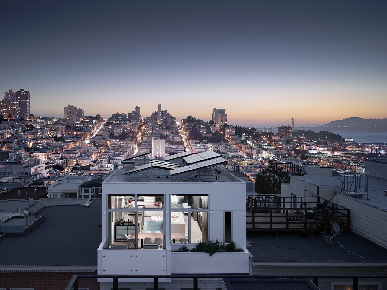 The top floor living area maximizes views out architecture, building, city, cityscape, cloud, condominium, daytime, downtown, dusk, evening, horizon, metropolis, metropolitan area, morning, real estate, reflection, residential area, roof, sea, sky, skyline, skyscraper, sunlight, tower block, town, urban area, water, blue, gray