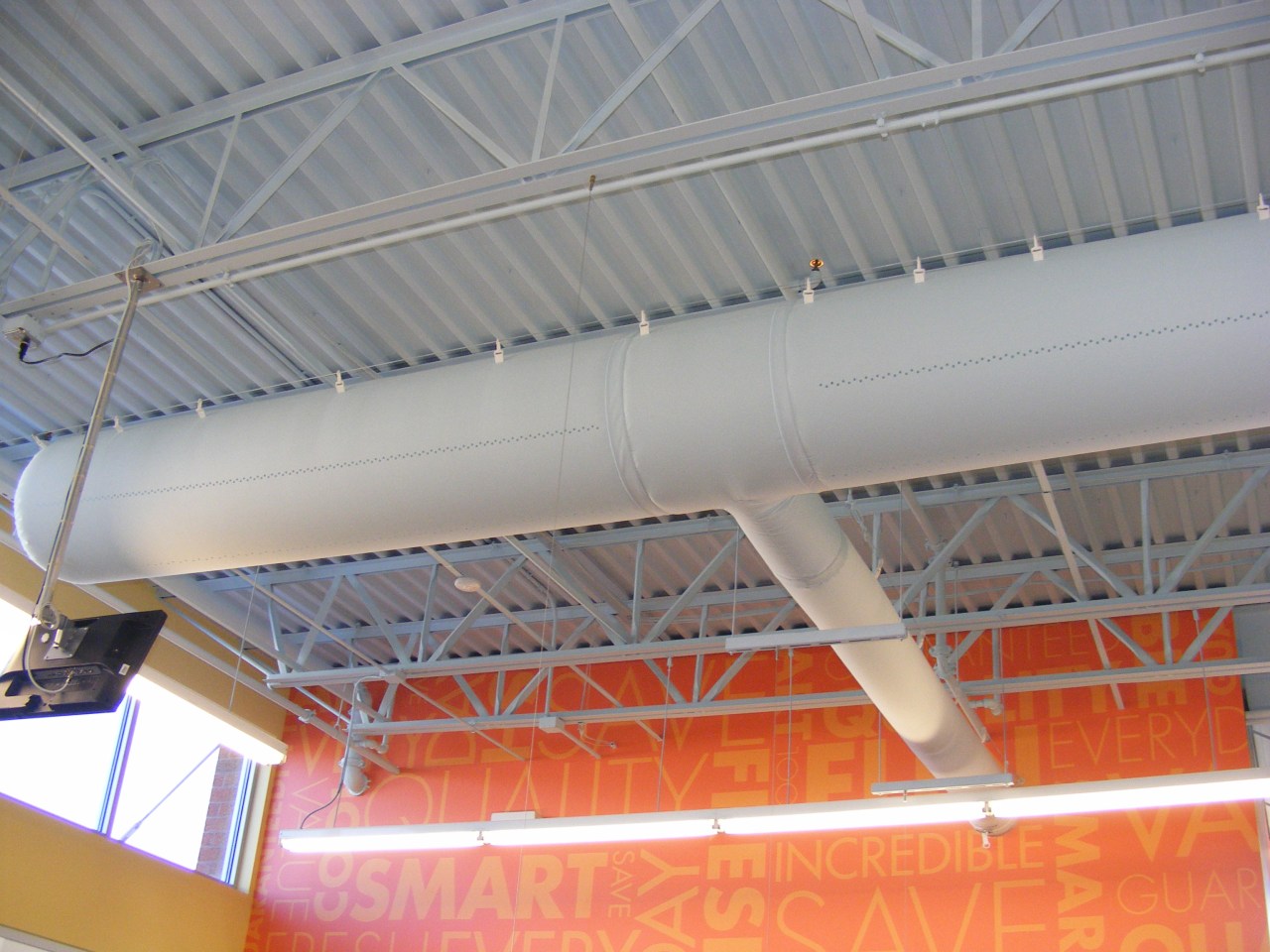 Close-up of the DuctSox Fabric Air Dispersion System, beam, ceiling, daylighting, roof, steel, structure, gray