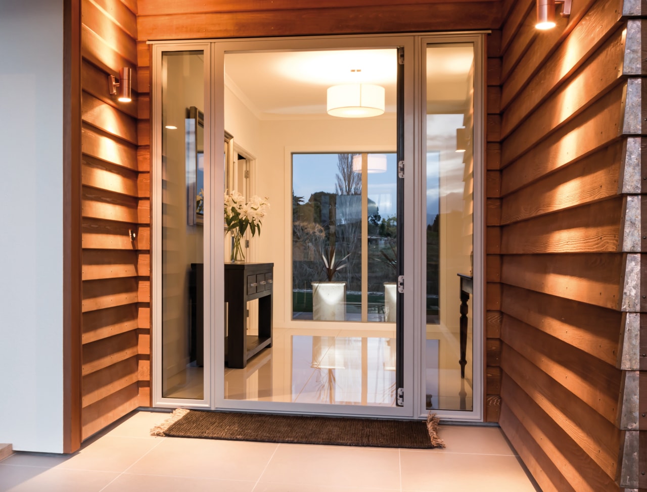 Cedar weatherboards line the entry to this new door, home, interior design, property, real estate, window, brown, orange