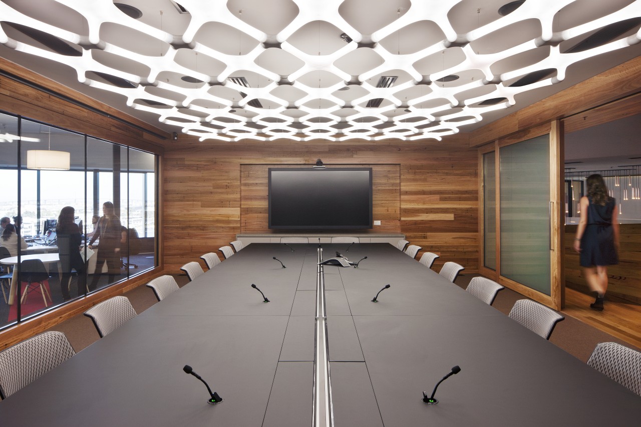 The wood veneer boardroom is a showcase for auditorium, ceiling, conference hall, daylighting, interior design, table, gray, white