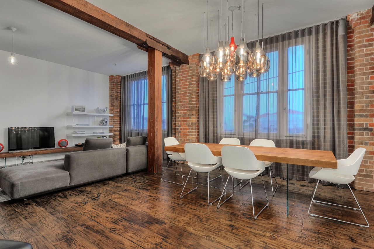 Original timber support beams, exposed brick walls and ceiling, floor, flooring, hardwood, interior design, living room, loft, real estate, room, table, wood flooring, gray, brown