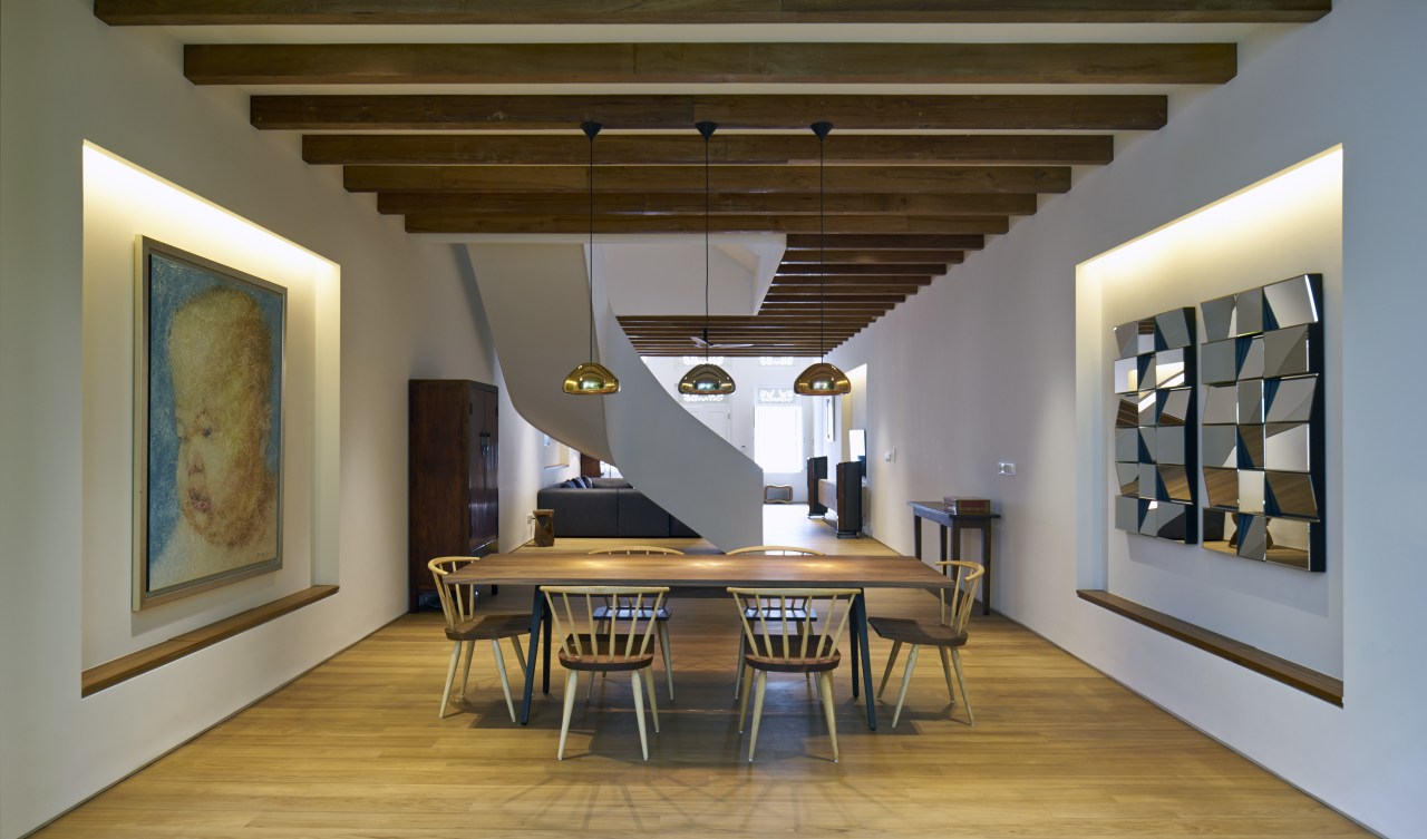 A sense of symmetry, first introduced on the architecture, ceiling, dining room, floor, house, interior design, room, table, brown, gray