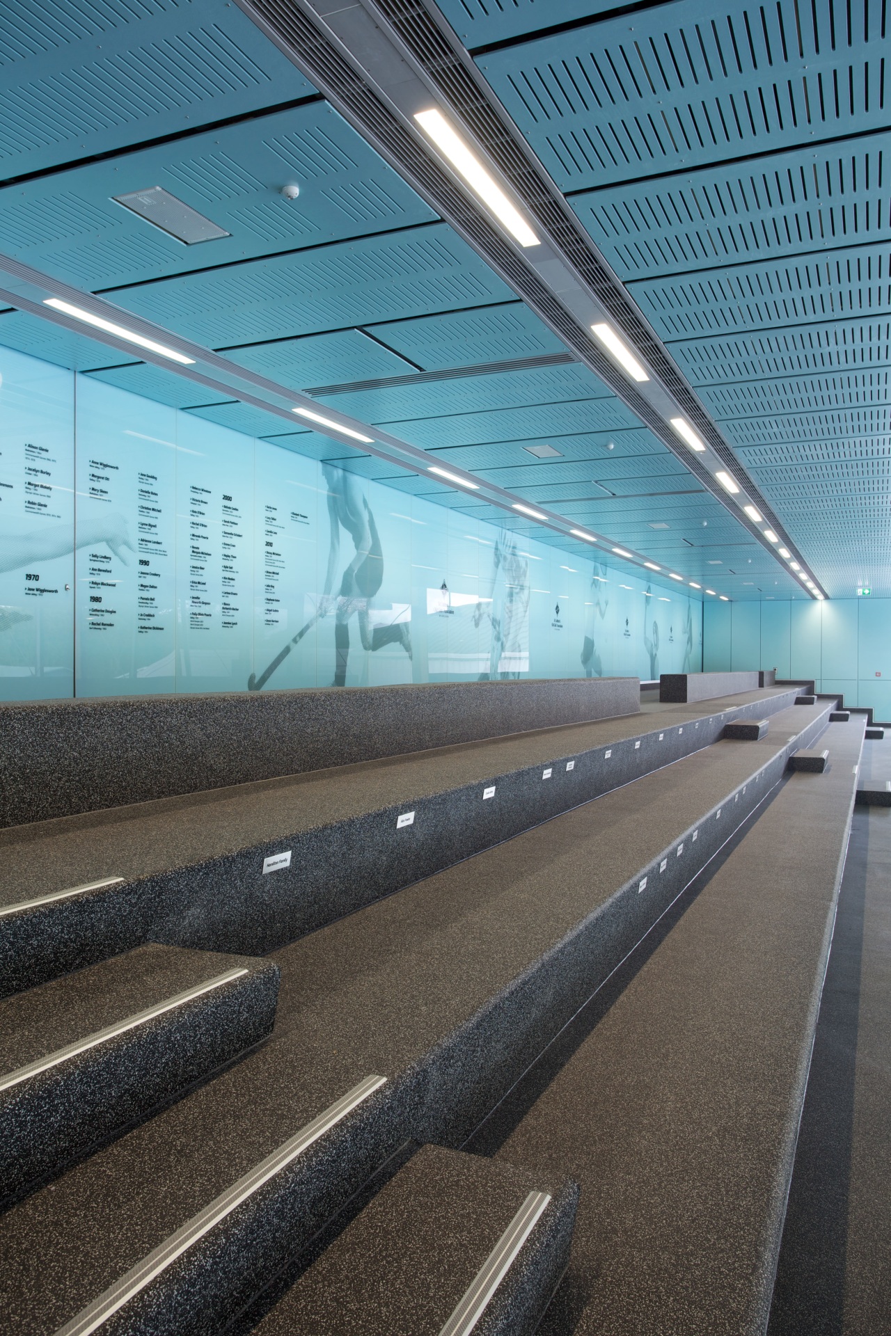 Spectator seating at the St Cuthberts Centennial Centre airport terminal, architecture, building, daylighting, fixed link, infrastructure, line, metropolitan area, reflection, sky, structure, teal, black