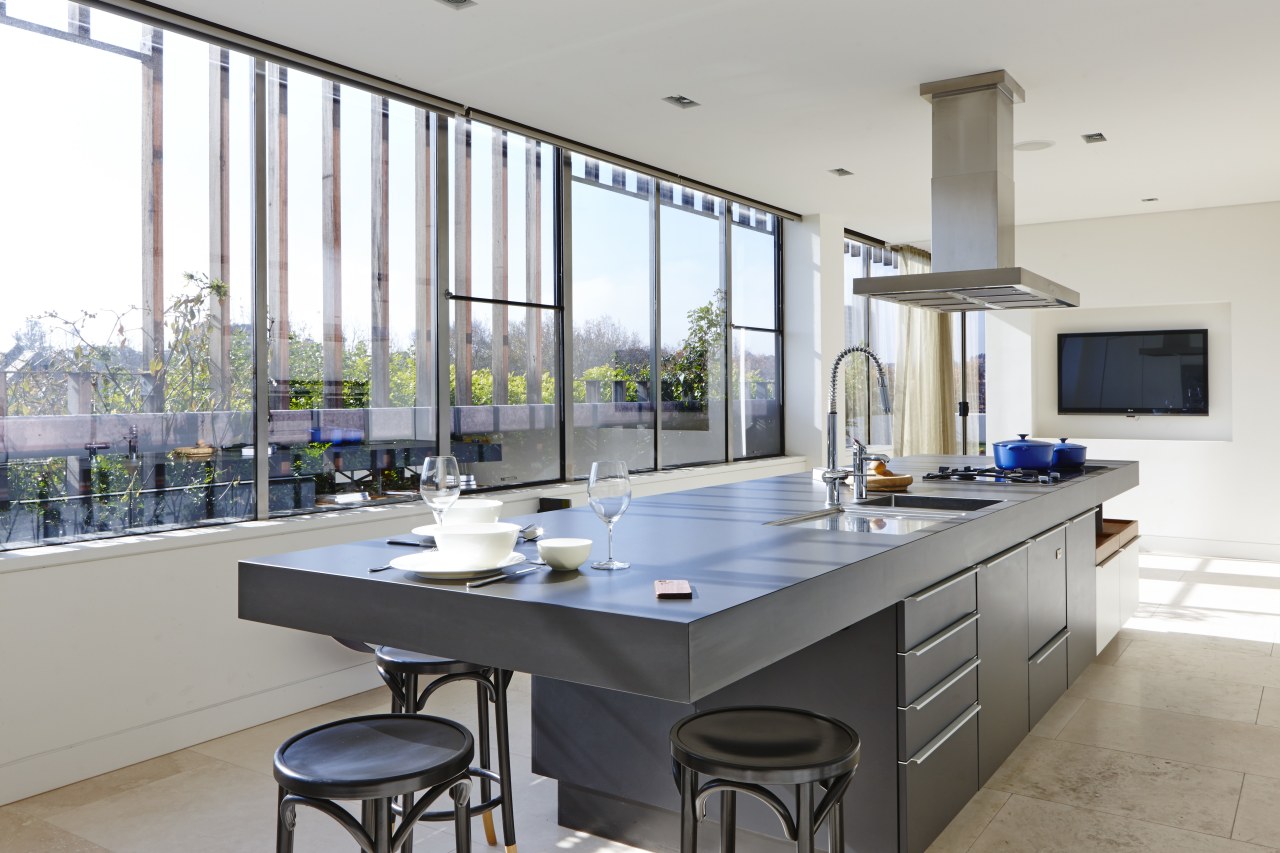 The other end of the island has space countertop, interior design, kitchen, real estate, gray