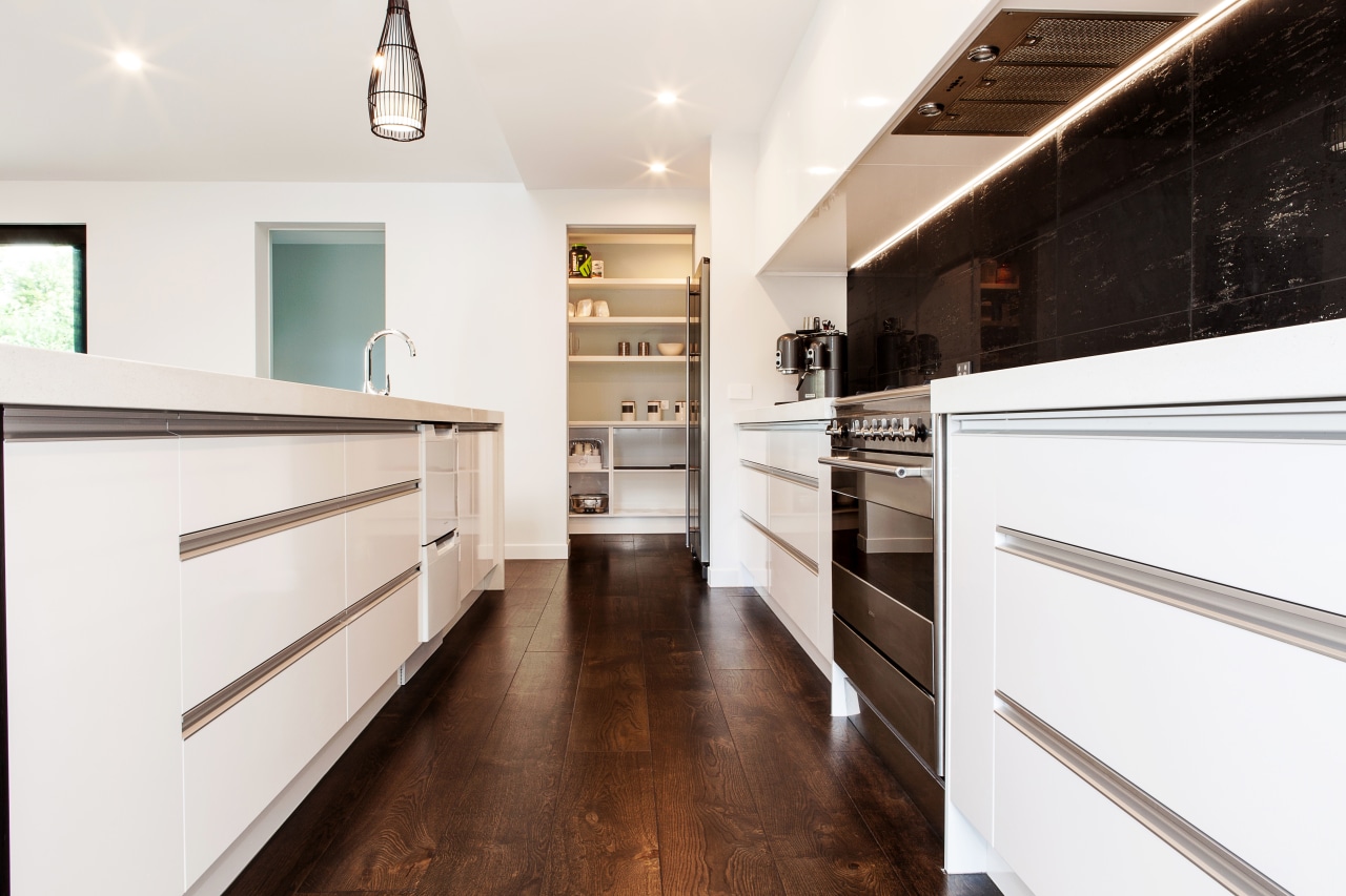 The benchtops in this new kitchen are in cabinetry, countertop, cuisine classique, floor, flooring, home, interior design, kitchen, room, white