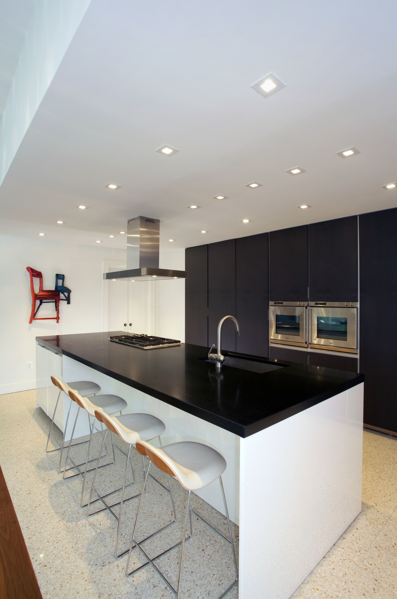 This kitchen designed by Nestor Santa-Cruz features a countertop, interior design, kitchen, real estate, room, gray, white