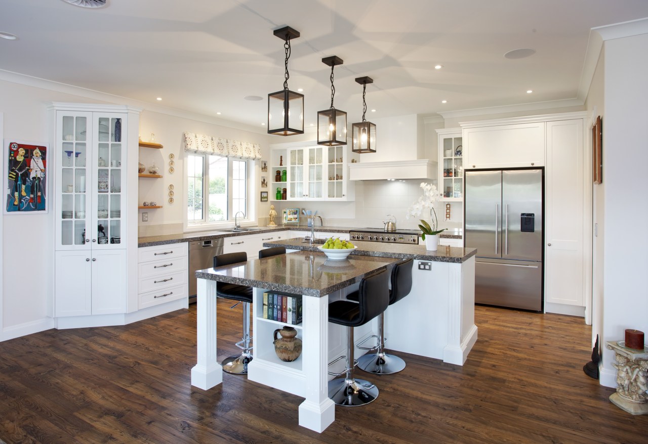 This high-end, traditional kitchen was produced by Mastercraft countertop, cuisine classique, floor, flooring, hardwood, interior design, kitchen, real estate, room, wood flooring, gray