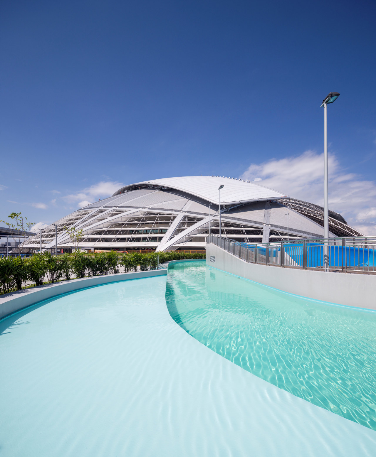 Public amenities at the Singapore Sports Hub include architecture, leisure, resort, sea, sky, swimming pool, vacation, water, blue, teal