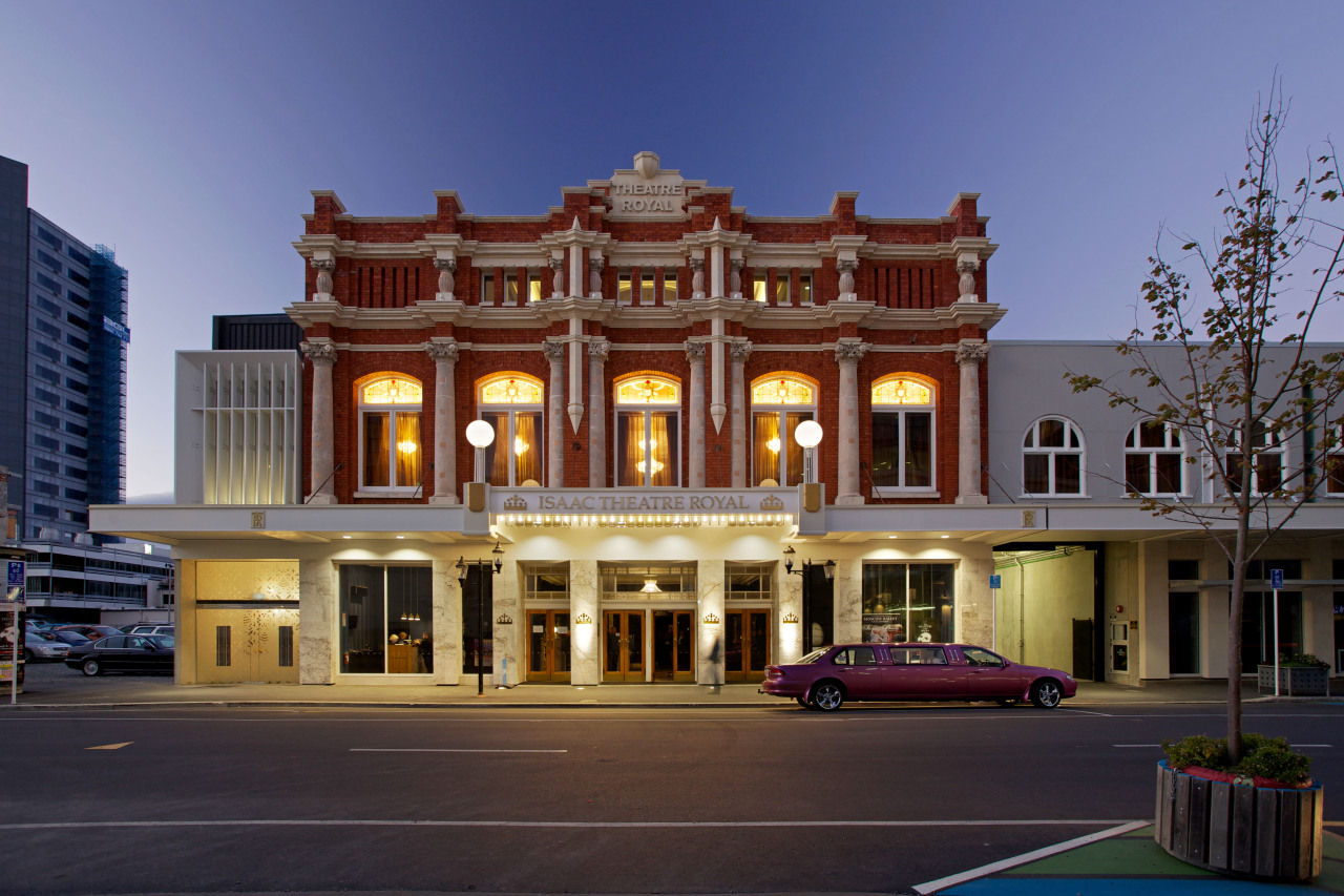 The Isaac Theatre Royal in Christchurch has undergone architecture, building, city, classical architecture, commercial building, downtown, elevation, estate, facade, home, hotel, house, landmark, mansion, metropolis, metropolitan area, mixed use, neighbourhood, plaza, real estate, residential area, sky, town, blue