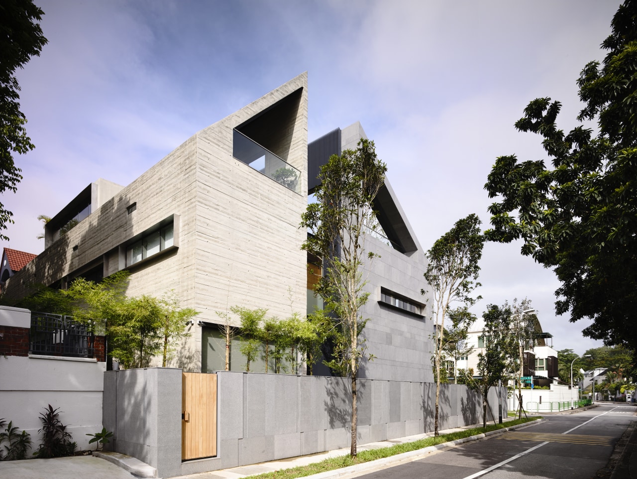 The two wings of this large family home apartment, architecture, building, condominium, facade, home, house, mixed use, neighbourhood, property, real estate, residential area, blue