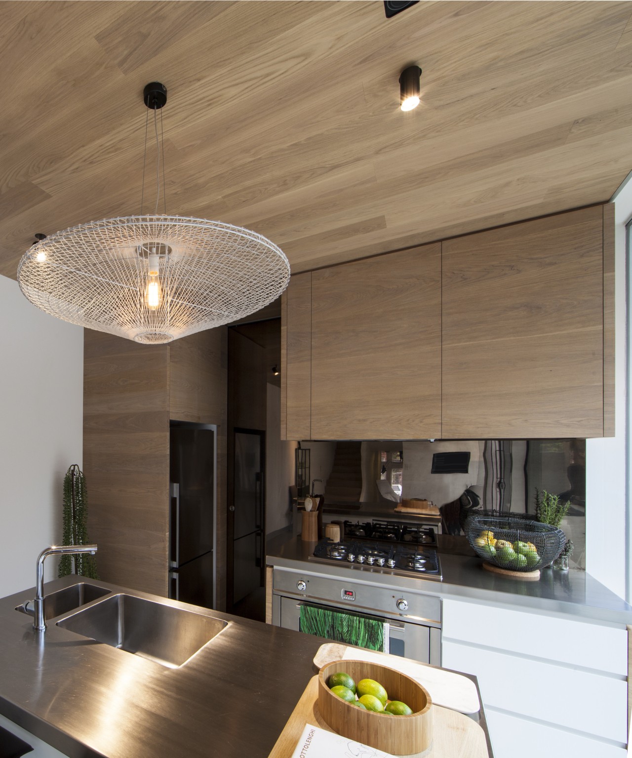 This kitchens pantry is concealed behind a shiny architecture, ceiling, countertop, cuisine classique, interior design, kitchen, light fixture, real estate, brown