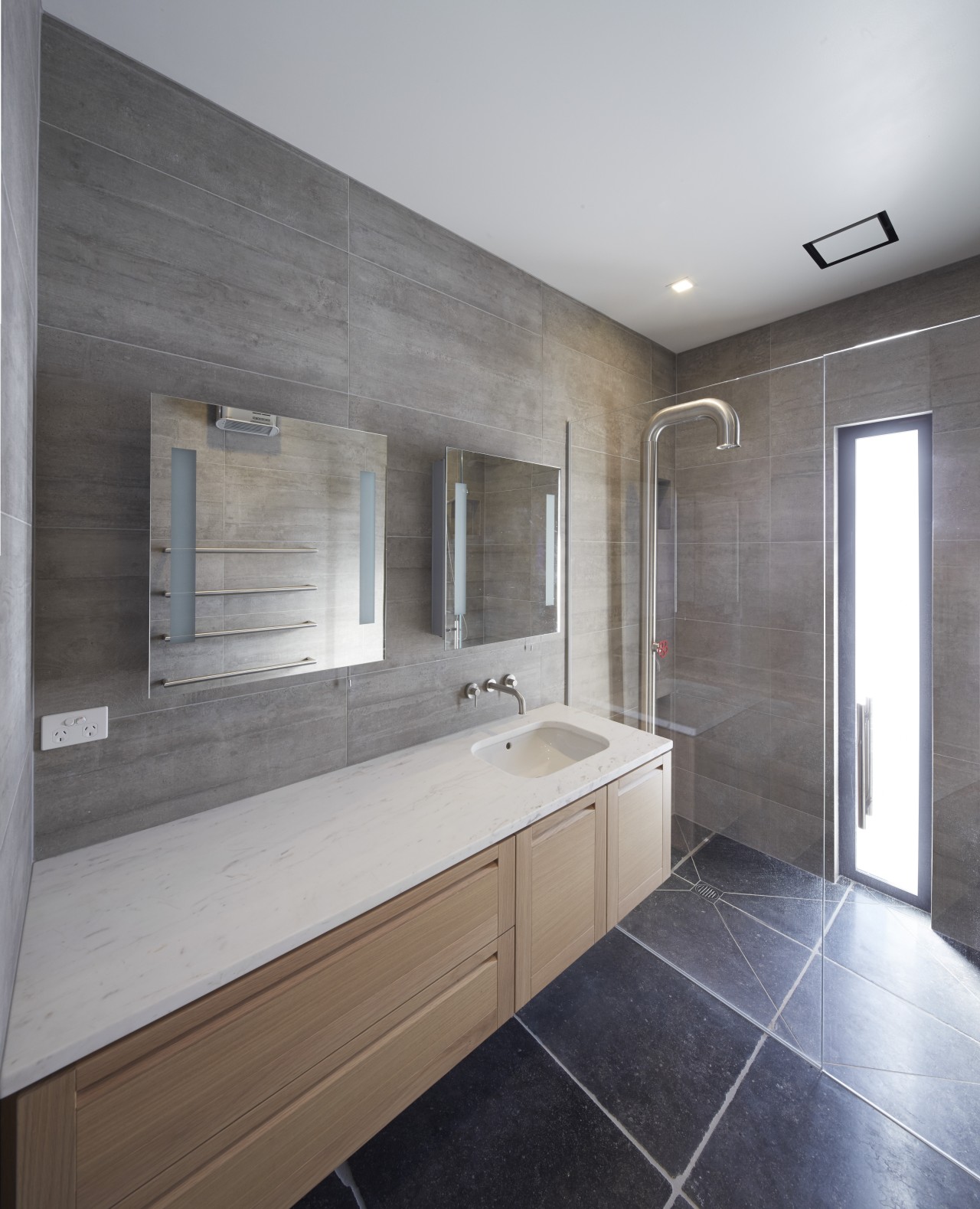 In this bathroom design by Rachel Barnes, the bathroom, countertop, floor, home, interior design, real estate, room, sink, gray