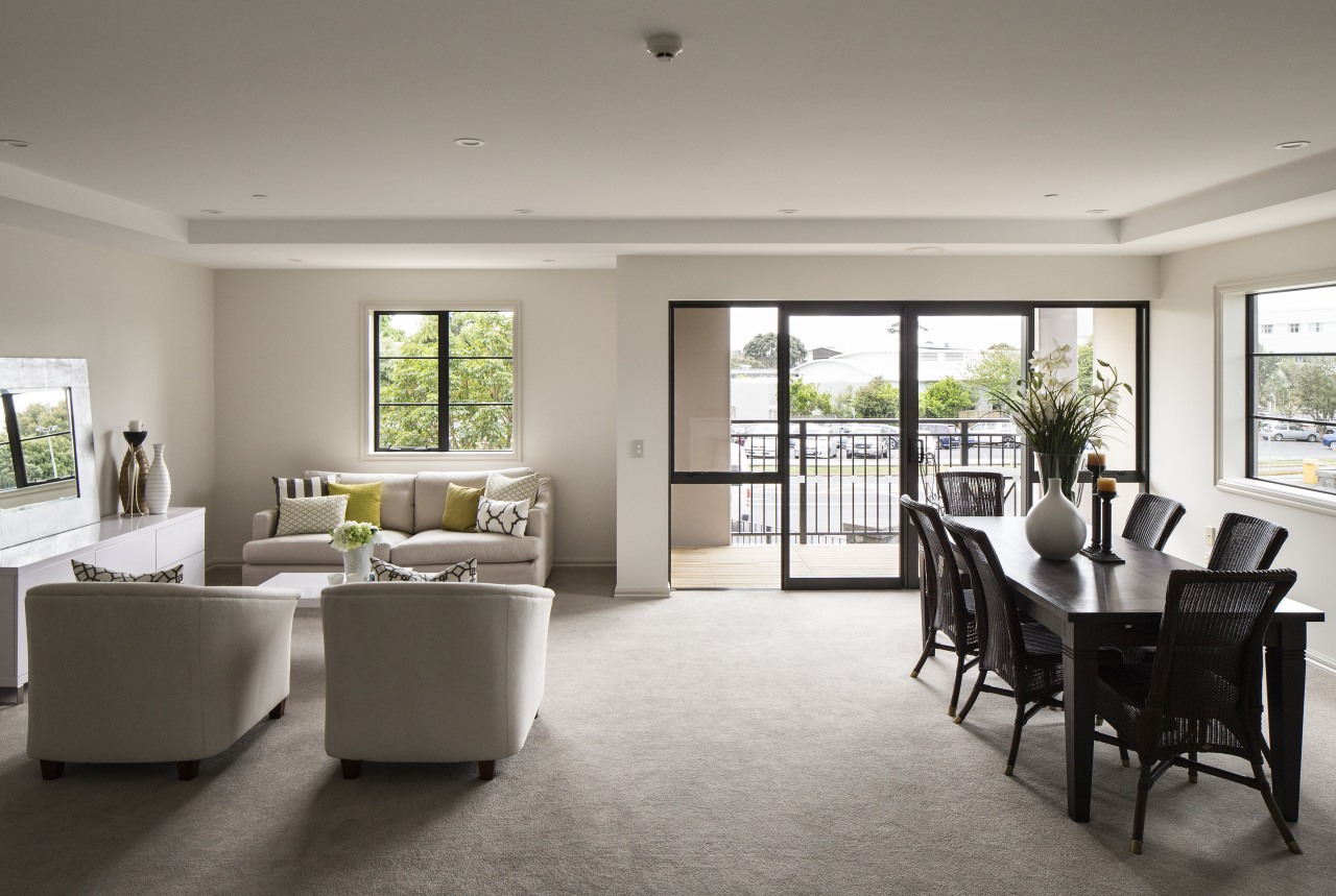 The design of Takapunas The Poynton retirement village floor, flooring, home, house, interior design, living room, property, real estate, room, table, window, gray