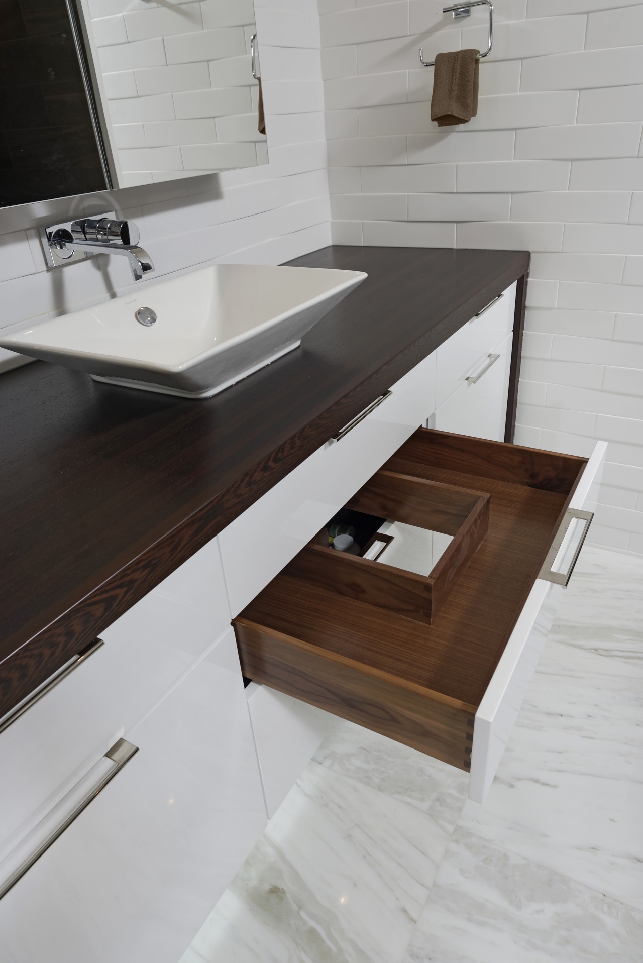 In this bathroom, two u-shaped drawers below the countertop, floor, furniture, plumbing fixture, product design, sink, table, tap, wood, gray