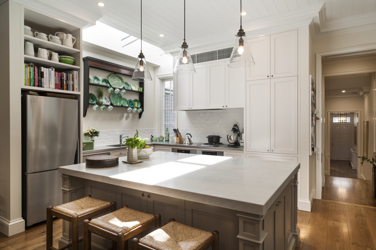 A furniture-like island with corner detailing and a cabinetry, countertop, cuisine classique, interior design, kitchen, real estate, room, gray, brown