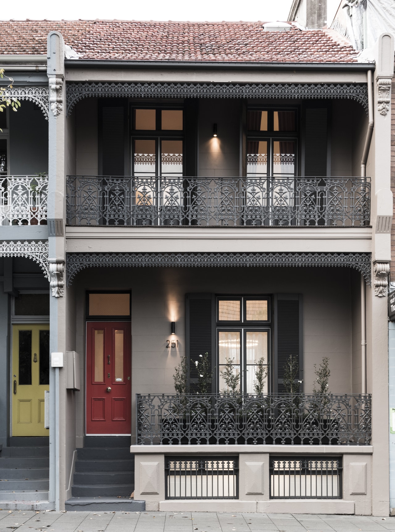 The freshly restored, elegant facade on this house architecture, balcony, building, door, facade, home, house, neighbourhood, property, real estate, residential area, window, black, white