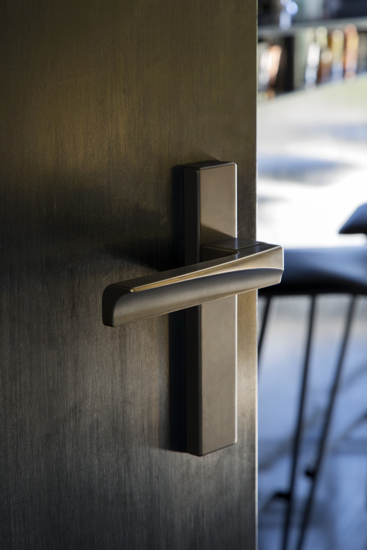 Arch Lever Handles by Chant were reworked to angle, product design, wood, brown, black