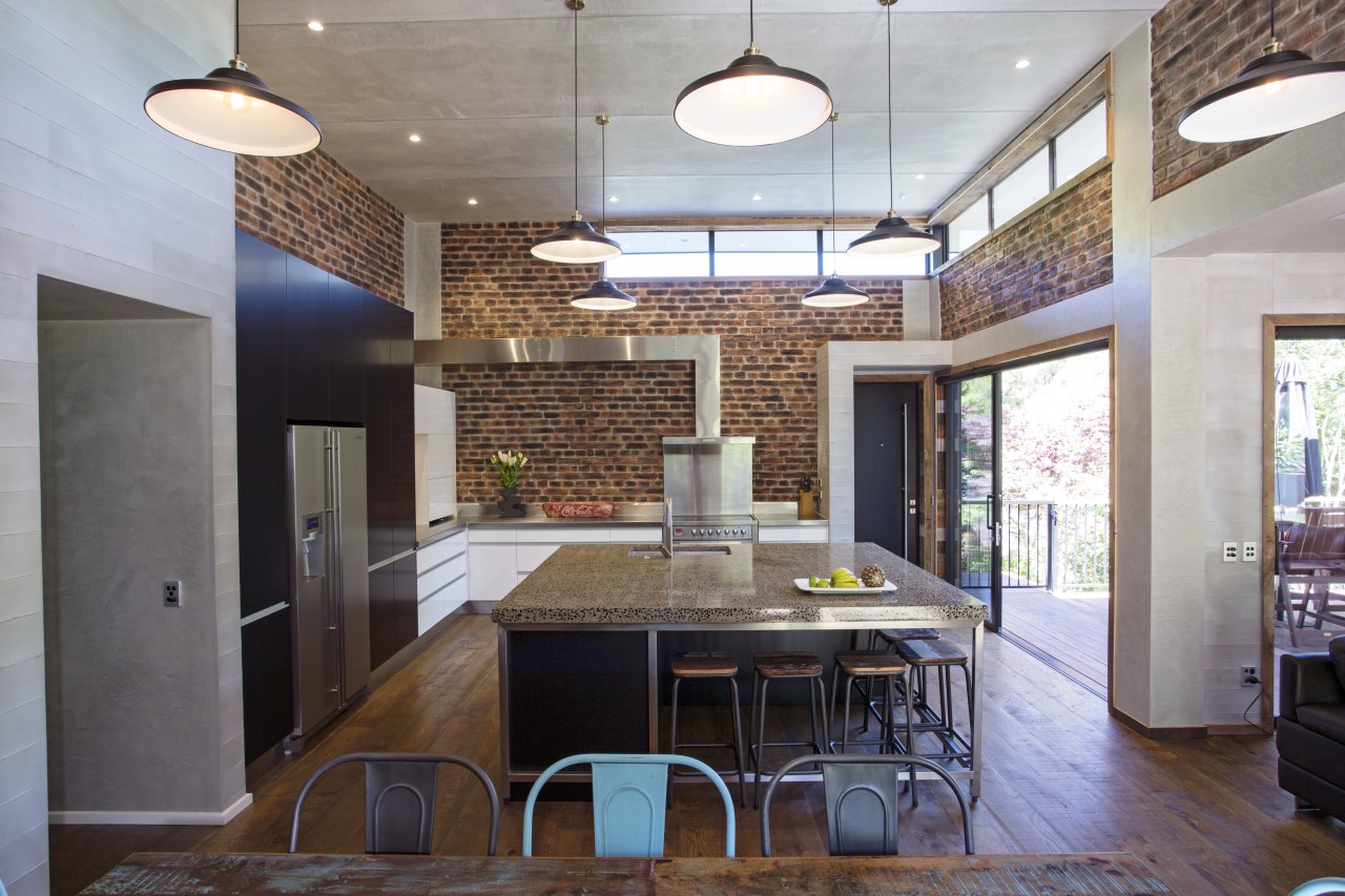 This island combines a concrete benchtop, Melteca cabinet architecture, ceiling, countertop, daylighting, interior design, kitchen, real estate, room, gray