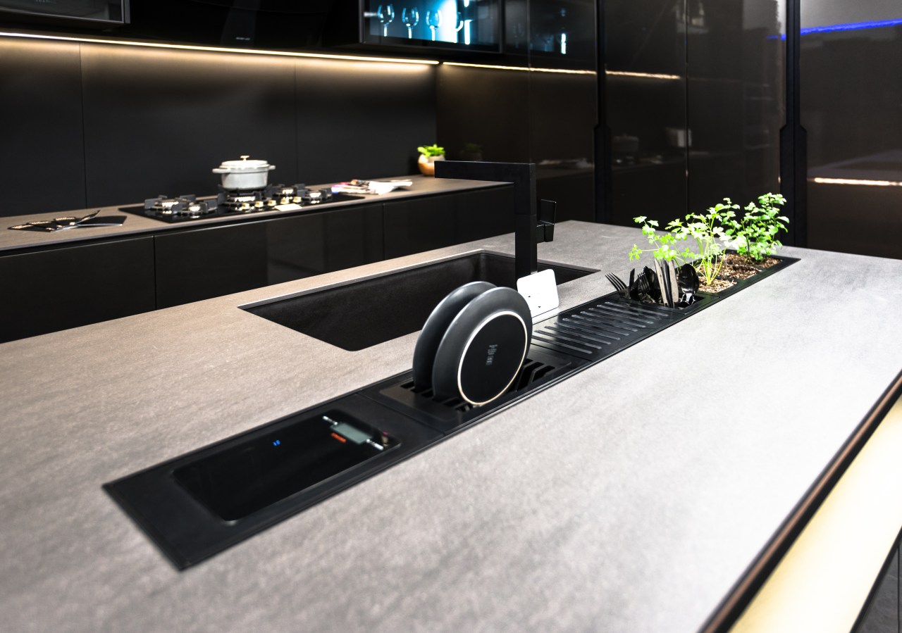 While refined and glamorous, this modern kitchen is product design, technology, black, white