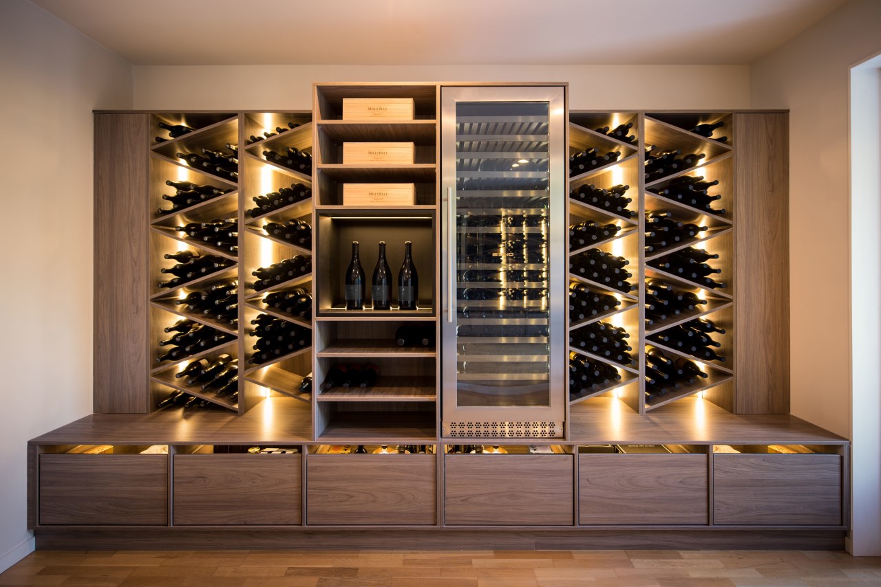 This sculptural, furniture-like wine display responds directly to furniture, wine cellar, wine rack, winery, brown