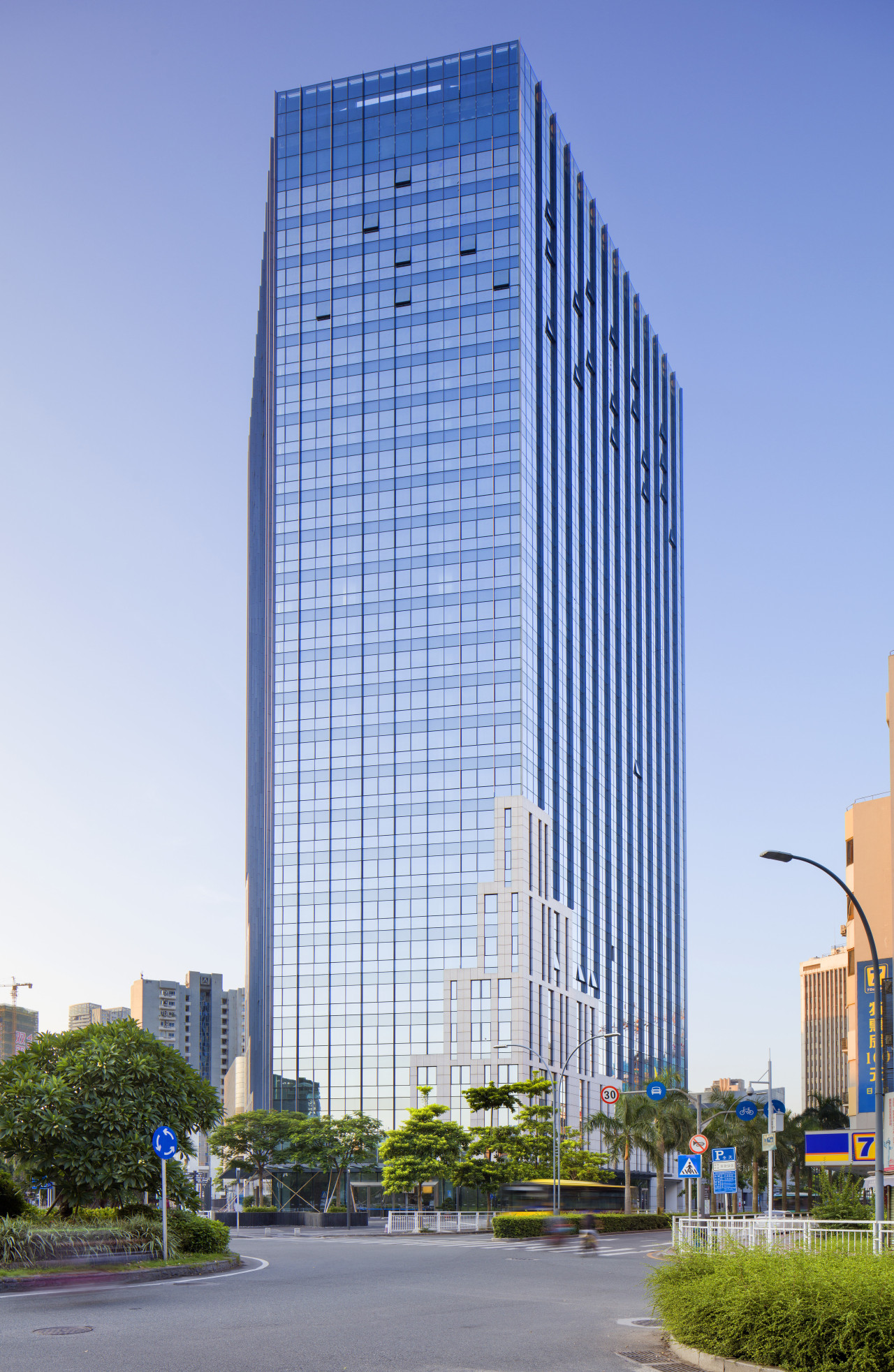 The 110m-high office tower at Shekou Gateway One architecture, building, city, cityscape, commercial building, condominium, corporate headquarters, daytime, downtown, facade, headquarters, landmark, metropolis, metropolitan area, mixed use, neighbourhood, reflection, residential area, sky, skyline, skyscraper, tower, tower block, urban area, teal