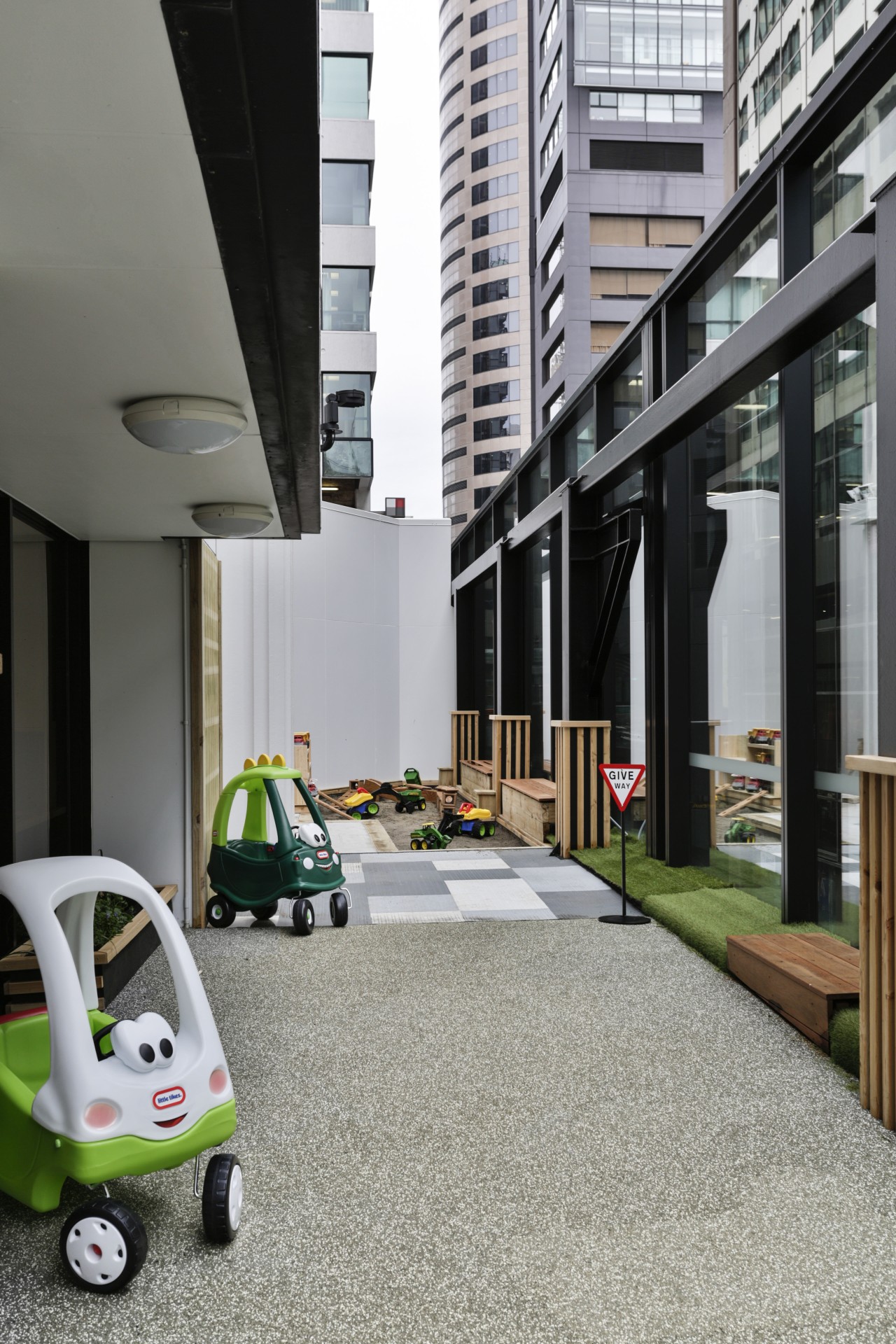 The outdoor area to the side of Cosmokids architecture, floor, house, gray, black