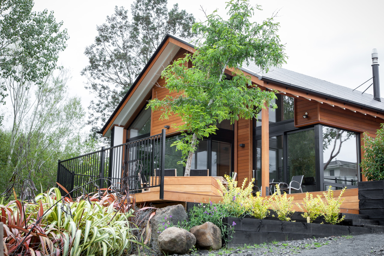 This home by Dwelling Architectural Design takes its architecture, backyard, cottage, facade, farmhouse, home, house, property, real estate, siding, yard, white