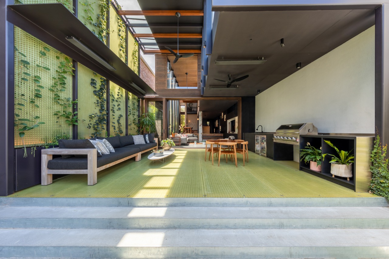 A generous covered living space extends the social 