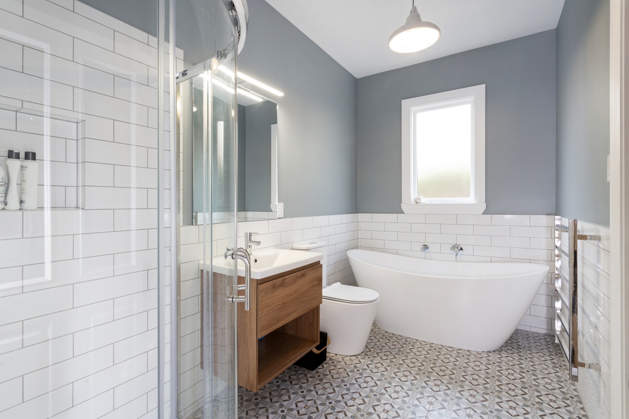 A period-look wall colour, classic freestanding tub and architecture, bathroom, bathroom accessory, bathroom cabinet, building, ceiling, floor, furniture, home, house, interior design, plumbing fixture, property, real estate, room, tile, gray