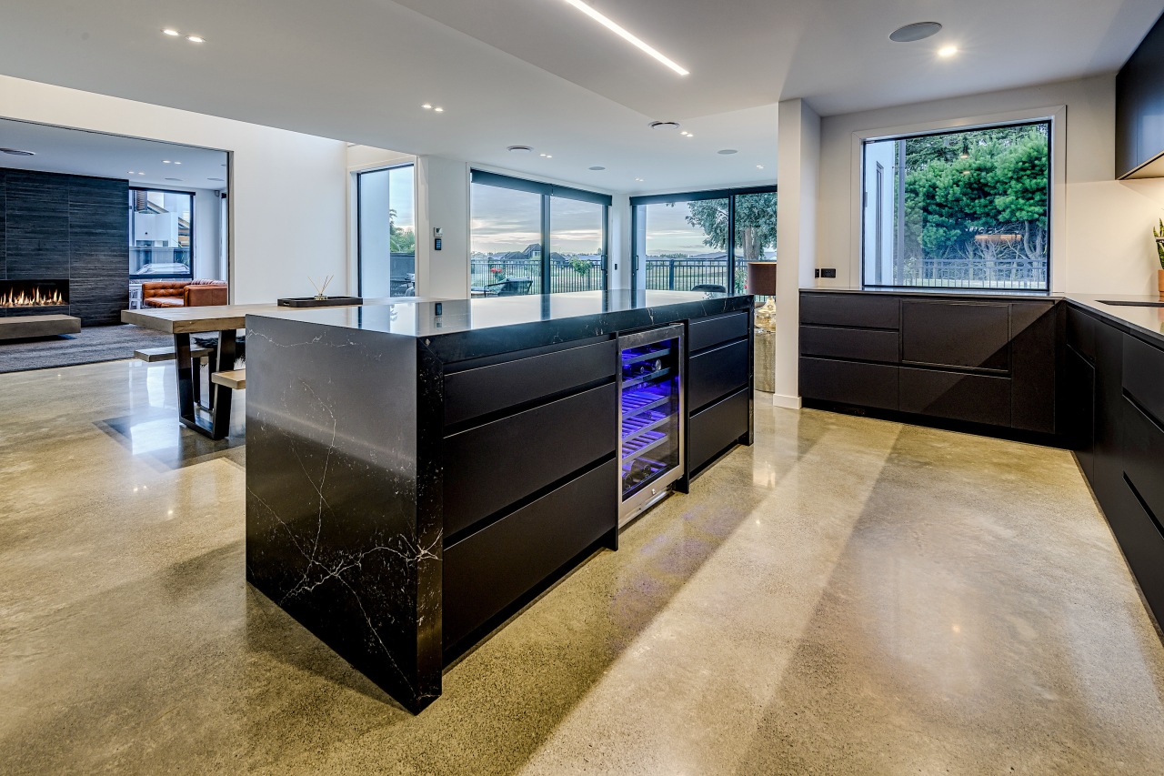 Polished concrete floors anchor this dark kitchen without architecture, building, cabinetry, ceiling, countertop, design, floor, flooring, furniture, glass, home, house, interior design, kitchen, living room, material property, property, real estate, room, tile, wall, gray