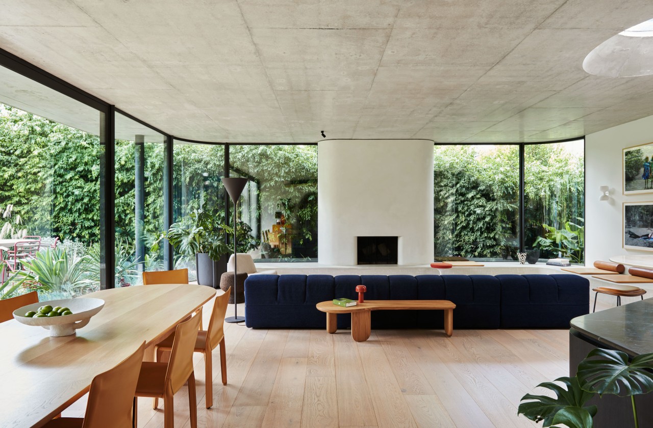 A wood dining table complements the floor finish 