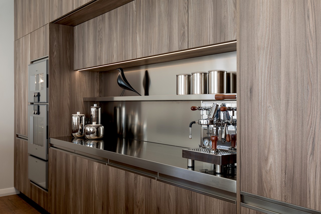 Stainless steel shelving adds to the kitchen's light architecture, building, cabinetry, ceiling, countertop, cupboard, floor, furniture, hardwood, home, house, interior design, kitchen, material property, property, room, shelf, wall, gray, brown