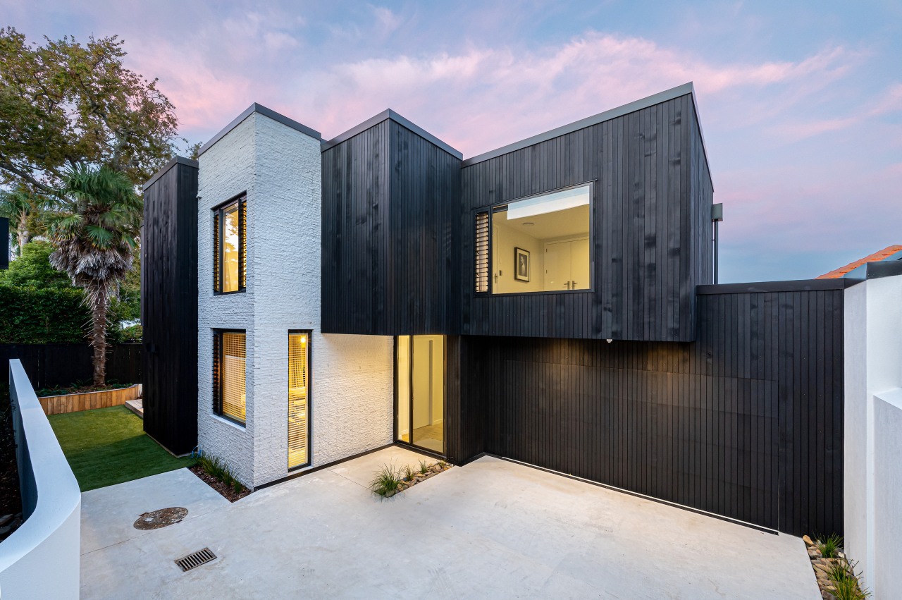 Striking two-tone cladding is part of teh home's 