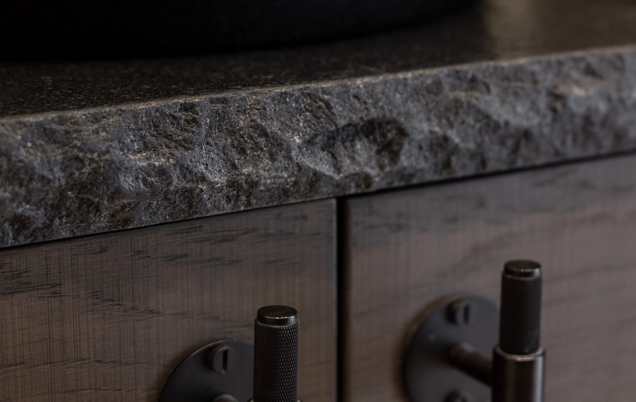 A rock edge stone benchtop adds to the 