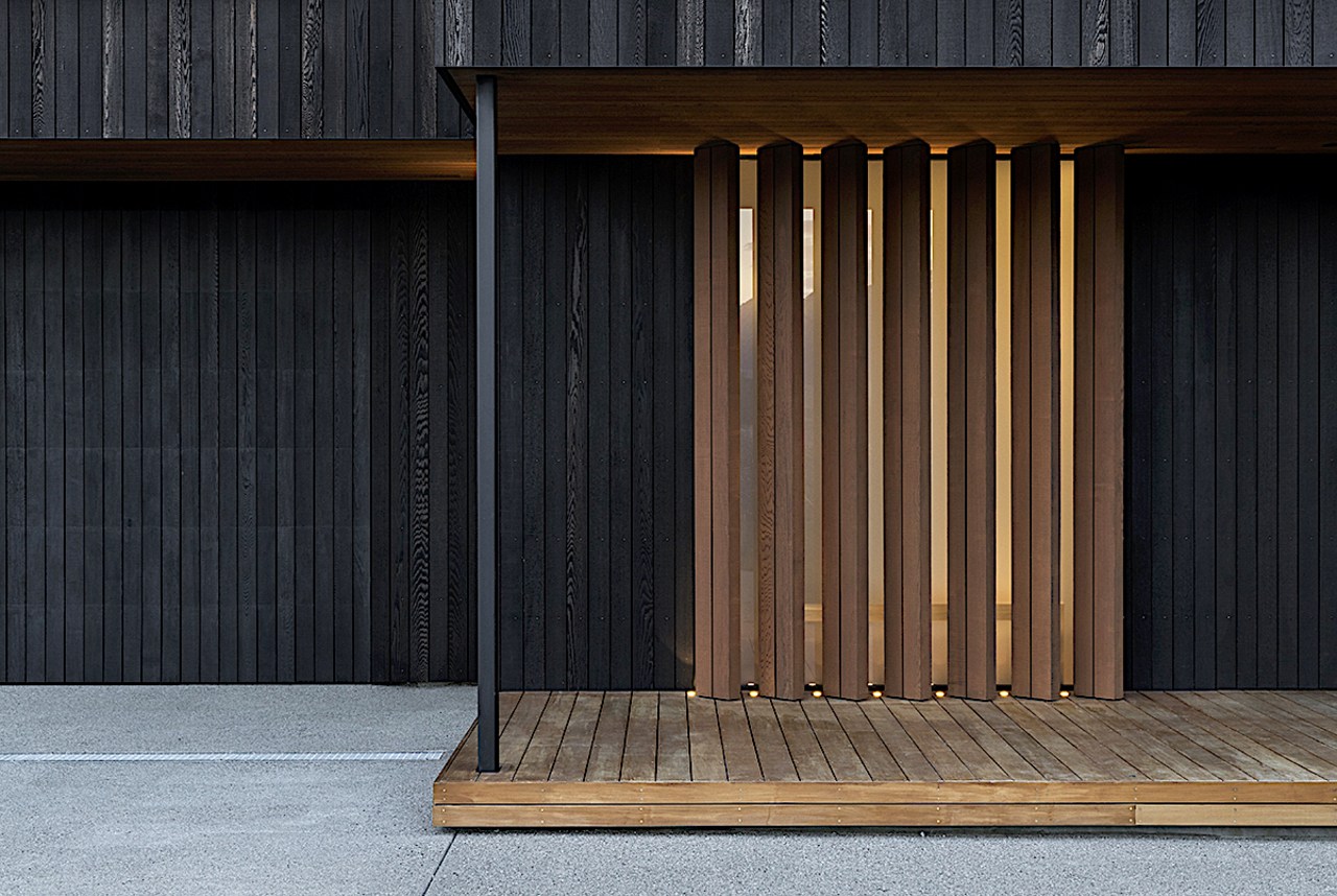 Timber fixed louvres set in front of opaque 