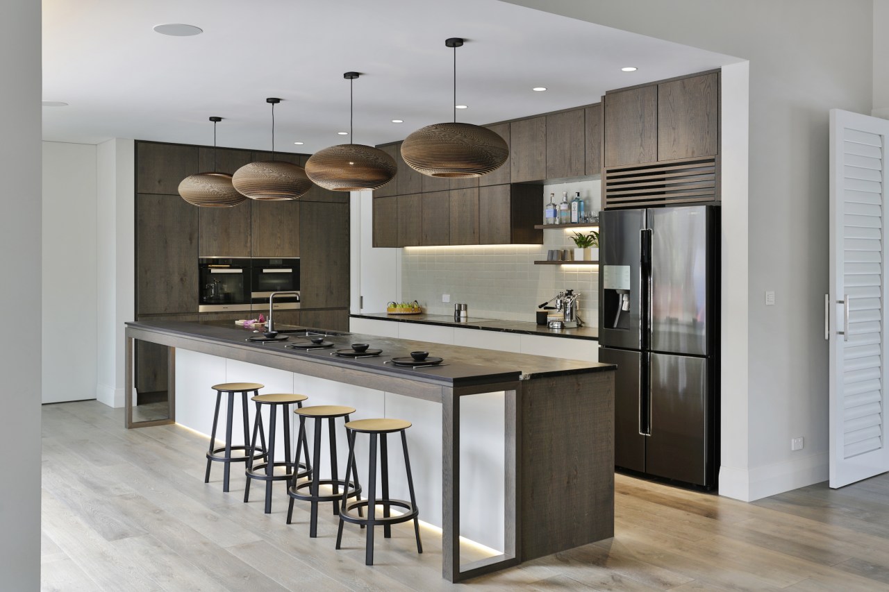 The designer specified textured oak cabinetry finishes, with 