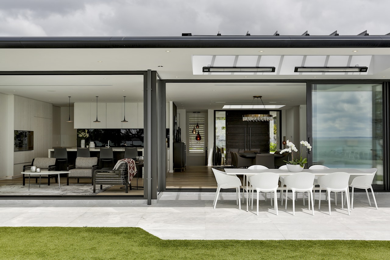 Deep cantilevered eaves with concealed guttering, featuring a gray