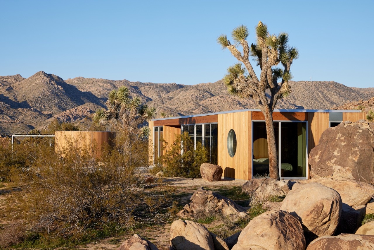 The home tones in with the landscape. - 