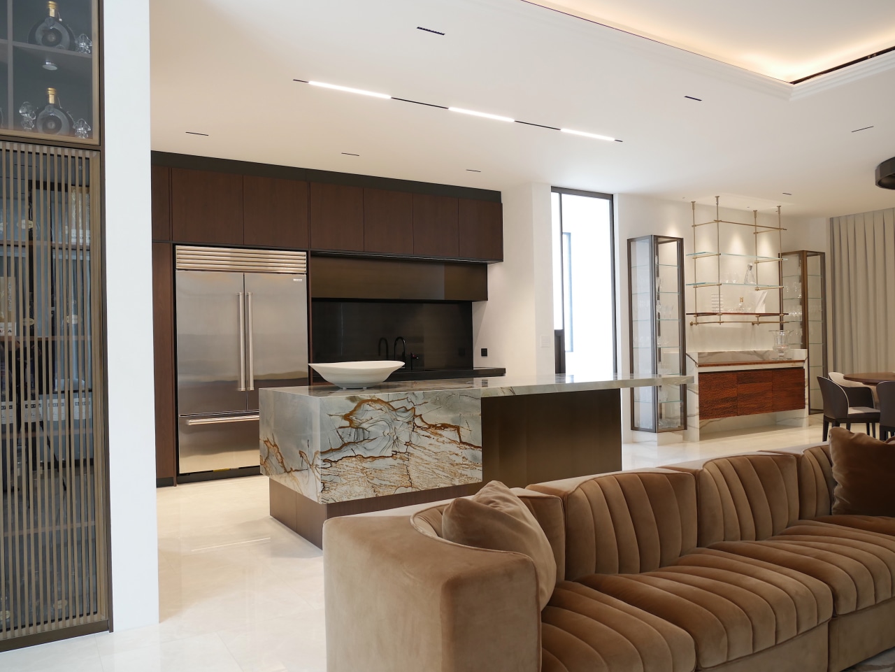The kitchen is designed to quietly anchor the 