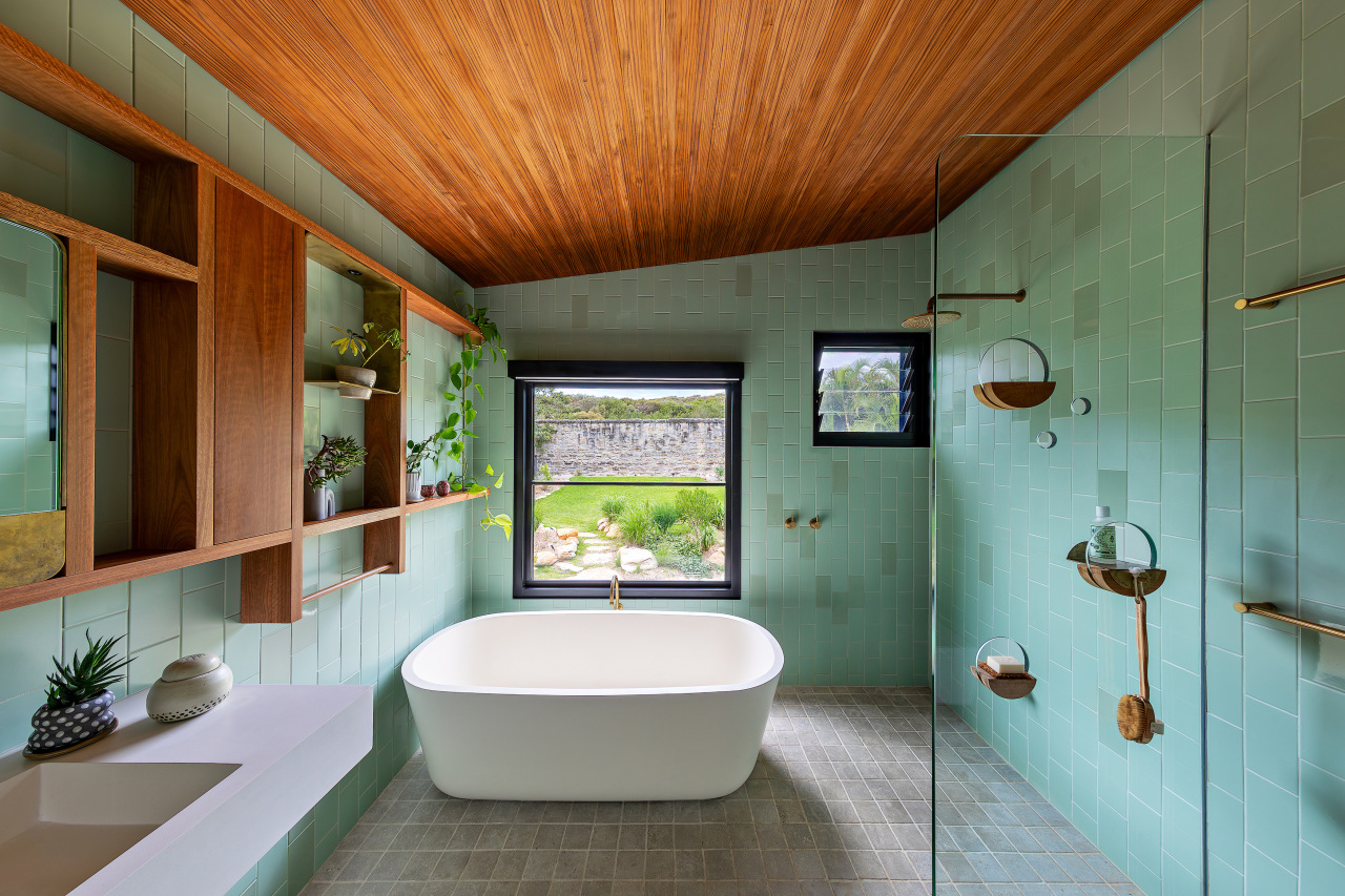 The bathroom's material palette reflects and connects with 